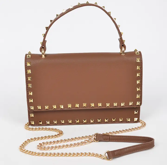 Metal studded faux leather clutch