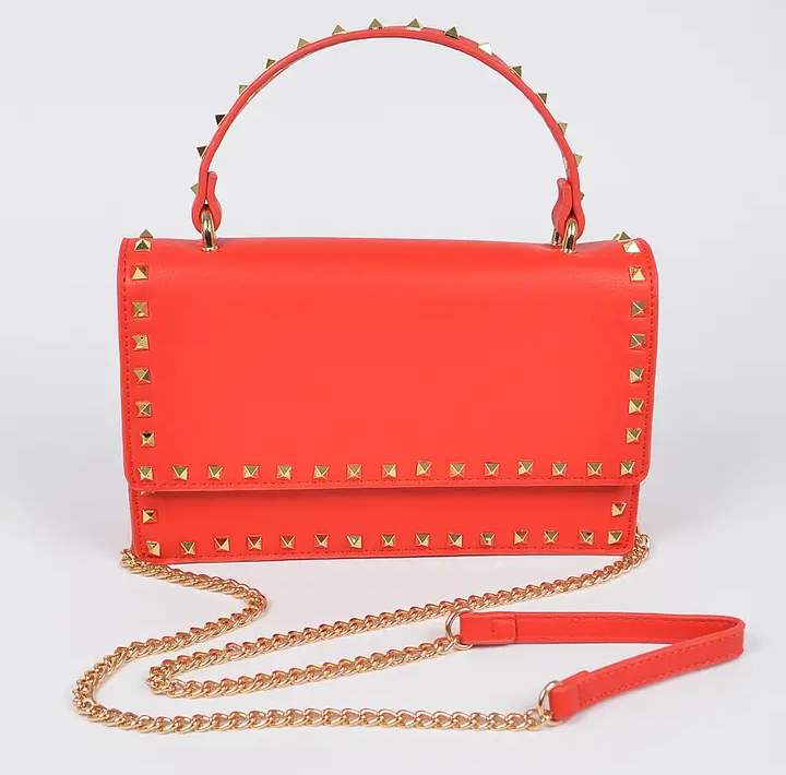 Metal studded faux leather clutch